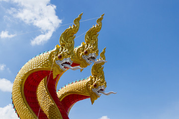 Fototapeta na wymiar Naga statue and Blue sky background