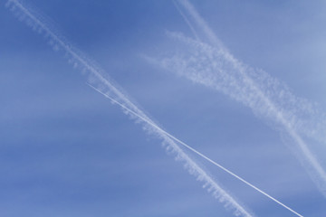 Fototapeta na wymiar Condensation trails in a blue sky