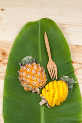 fresh slice of sweet pineapple on banana leaf