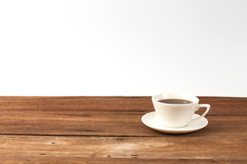 cup of  coffee on old hard wood table