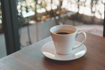  Cup of coffee on a wooden table
