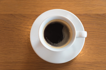  Cup of coffee on a wooden table