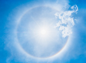 Looking up at Sun halo with circular rainbow at clear sky,natural phenomena