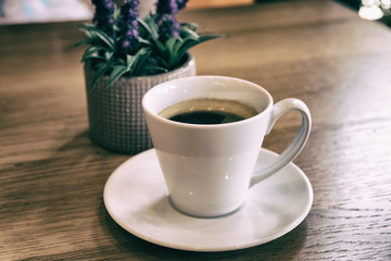  Cup of coffee on a wooden table