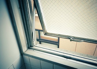 Obraz premium Vintage color filter, The window of the building opened up.