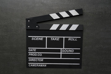 movie clapper on black table