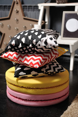 Pillows from a children's bed on large macaroons