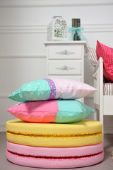 Pillows from a children's bed on large macaroons