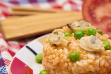Seafood risotto with tomato and peas