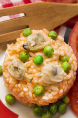 Seafood risotto with tomato and peas