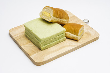 Pandan slice bread, butter flavor sugar hotdog bread on wooden trencher
