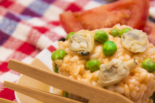 Seafood risotto with tomato and peas