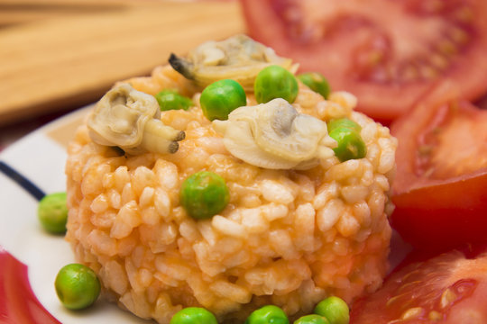 Seafood risotto with tomato and peas