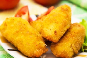 Plate with croquettes and tomato