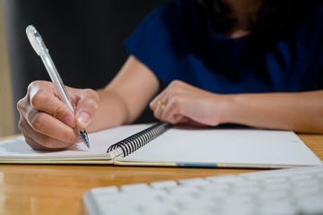 woman writing paper close up hand / close up pencil on hand