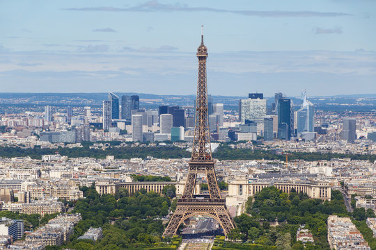 Eiffel tower in Paris against La Defense district