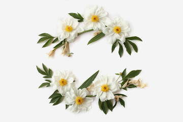 Floral wreath with white peonies, buds and needle-shaped leaves of iris isolated on white background. Flat lay, top view. Mother`s day concept.