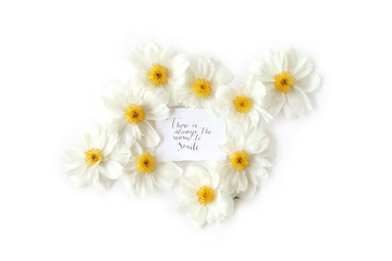 Flat lay view of label with english quote There is always the reason to smile. Inspiration words...