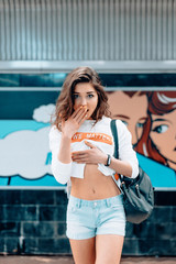 Obraz premium Beautiful young girl posing on metro station