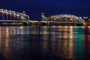 Naklejka na ściany i meble View of the bridge embankment, night view of the Sait-Petersburg
