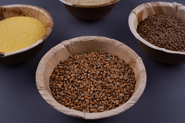 Four sorts of cereals in bowls.