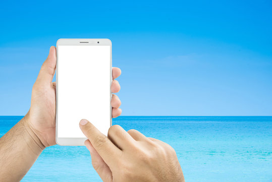 Man Hands Holding Mobile Phone Isolated Screens Display On The Beach Background.