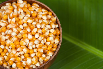 close up Organic corn seed on banana leaves background