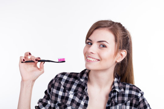 the girl in the bathtub with a toothbrush teeth smile