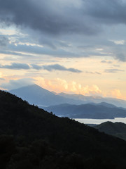Fototapeta premium Cloudy view from the mountains in Gocek, Turkey - beach town of Fethiye below