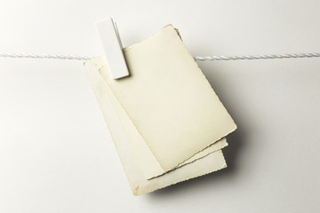 Vintage postcards hanging with clothespins