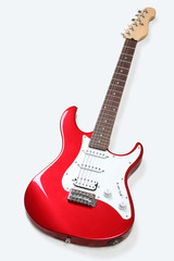 Fototapeta premium Red Electric Guitar isolated on white background