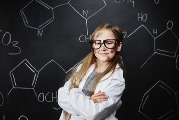 Portrait of little lady in chemical class