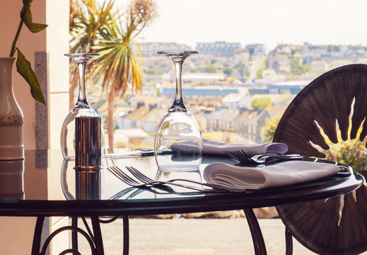 empty restaurant table and panorama Newquay