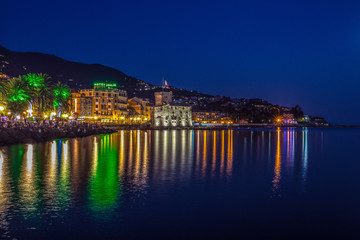 Fototapeta na wymiar RAPALLO, ITALY JULY, 1, 2015 - View of Rapallo, Genoa (Genova) province and the castle on the sea by night.