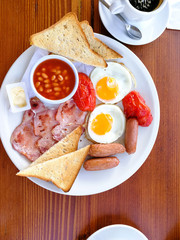 classical english breakfast with egg and fries