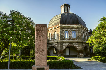 
 Ancient khachkar in front of the building of the Gevorkyan Theological Academy in Echmiadzin
