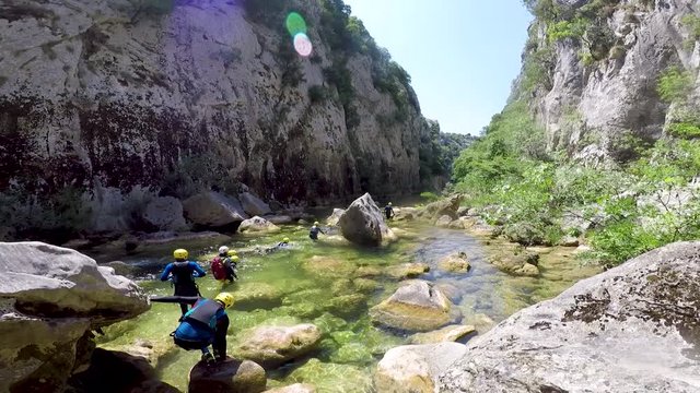group of people canyoning on Cetina river in Croatia