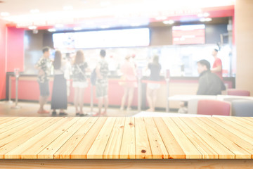 Empty wooden table in a fast food restaurant,for product placement.