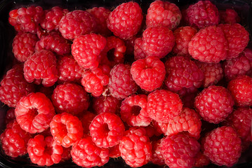 Fresh raspberries as background