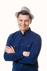 Young man in blue clothes on a white background.