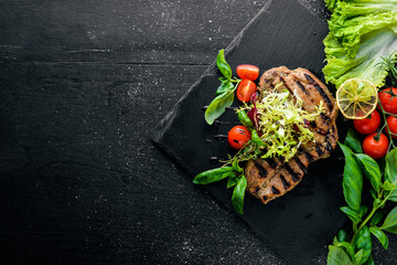 Veal steak cooked on grill. On a wooden background. Top review. Free space.