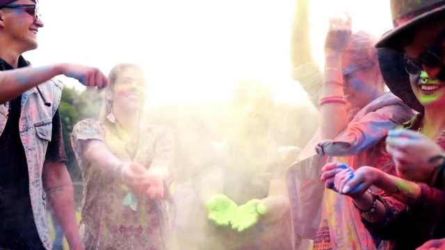 People throwing the holi colors at the festival 