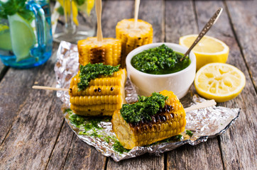 Grilled corn on sticks
