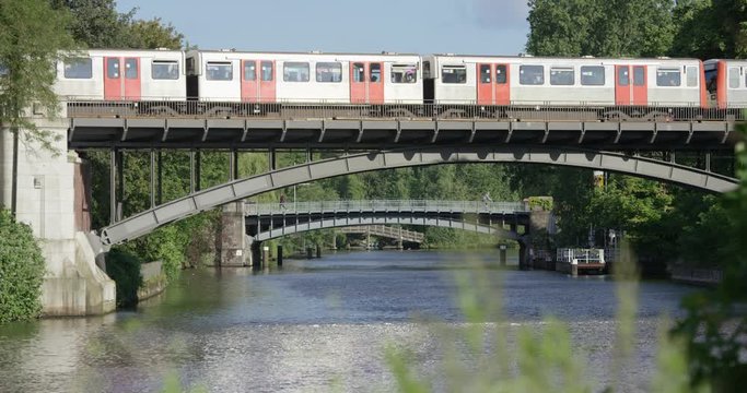 Metro Line is crossing a bridge over the River Alster in Hamburg, Germany