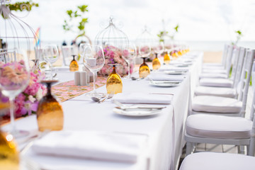 Table setting at a luxury wedding and Beautiful flowers on the table.