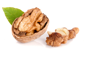 Walnut with leaf isolated on white background
