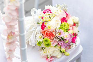 Beautiful bridal bouquet of flowers on a chair.