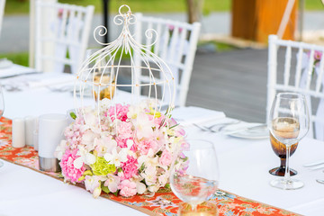 Table setting at a luxury wedding and Beautiful flowers on the table.