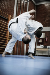 Fototapeta premium Two young males practicing judo together.