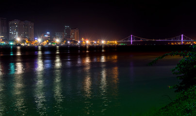 Fototapeta na wymiar Night view of modern buildings and Han River in Danang city
